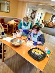 Carers making  cakes